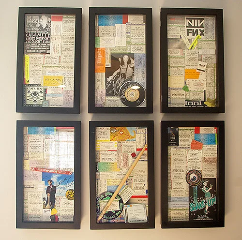 Our ticket wall displaying tickets and memorabilia from concerts we've attended.