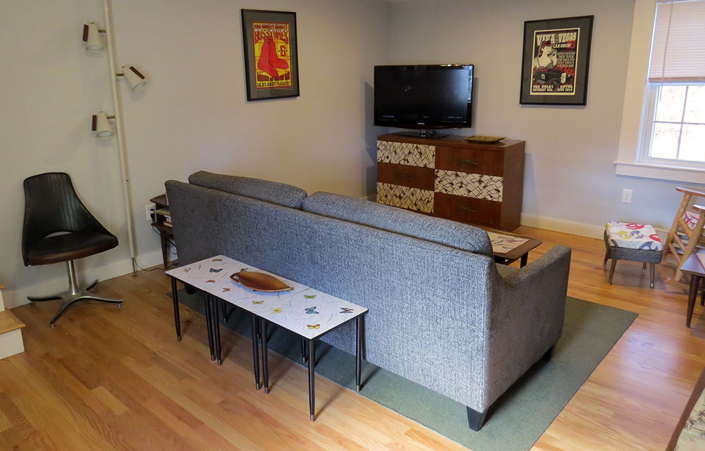 The tv stand is one we made out of a mid-century dresser .
