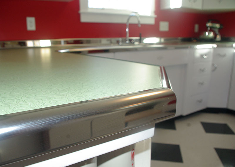 A close-up view of the metal trim replicating the Youngstown Kitchens trim.