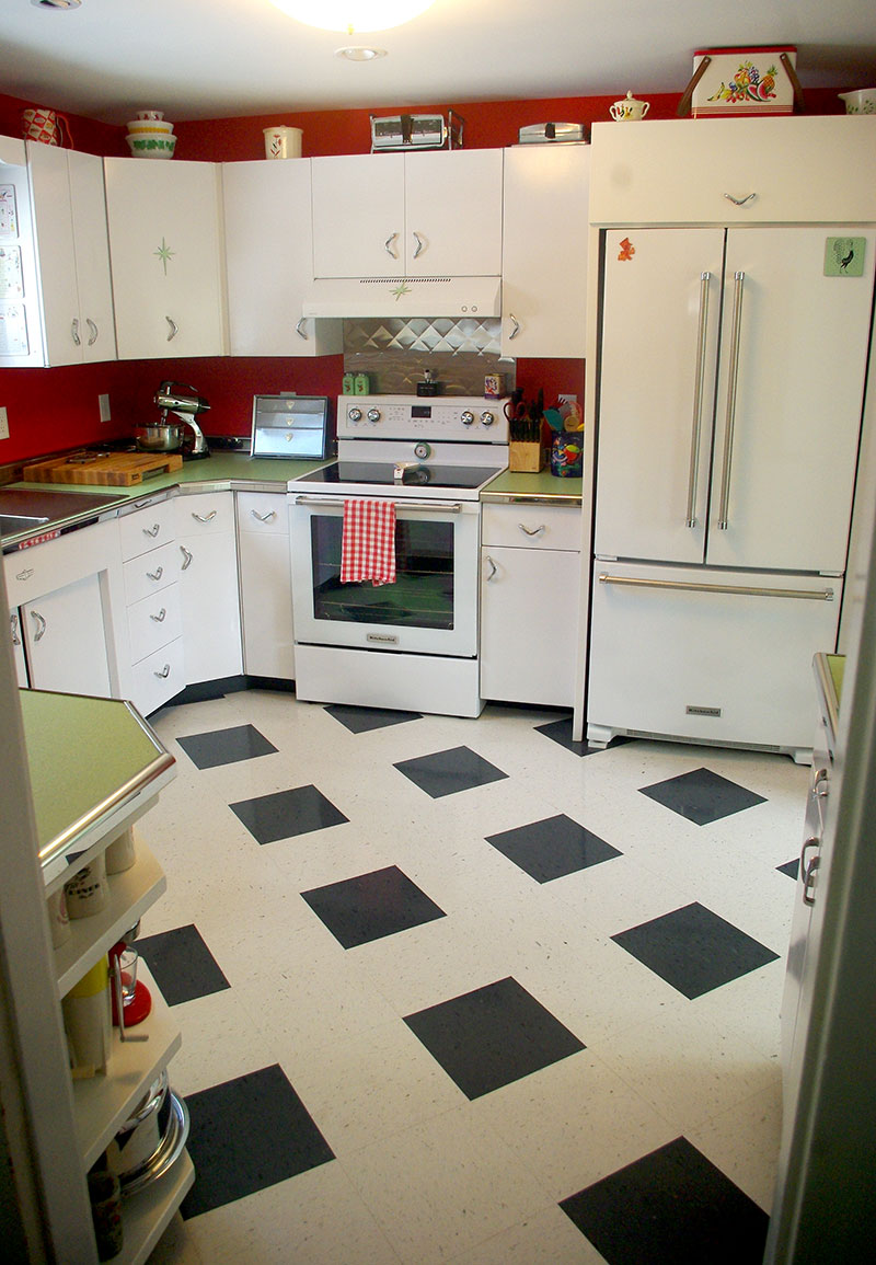 The view of the finished kitchen from the dining room. The stove and fridge are from Kitchenaid.
