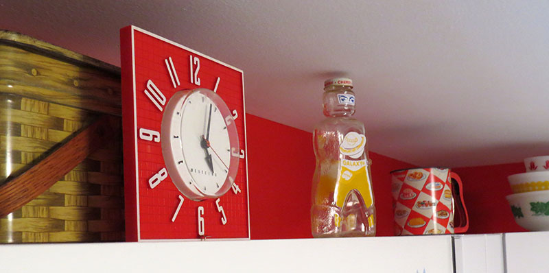 1950s Westinghouse Clock and other vintage decorations. The yellow bottle is an old Galaxy syrup bottle in the shape of a spaceman, from 1953.