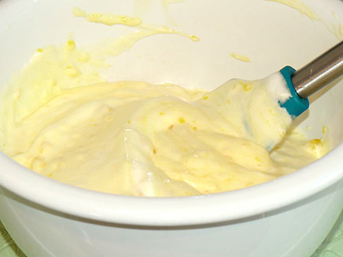 Folding the merengue into the orange mixture