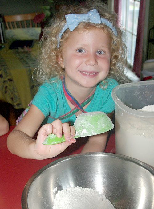 Julia adding flour to the mixture