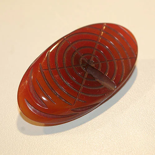 The log portion of the brooch