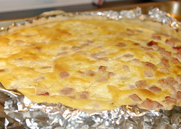 The quiche just out of the oven. The foil on the outside did a fair job holding most of the filling in place.