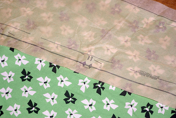 A close-up of a pattern piece showing a numbered notch. The corresponding notch was also labeled on a separate pattern piece and the two would eventually be lined up for sewing.