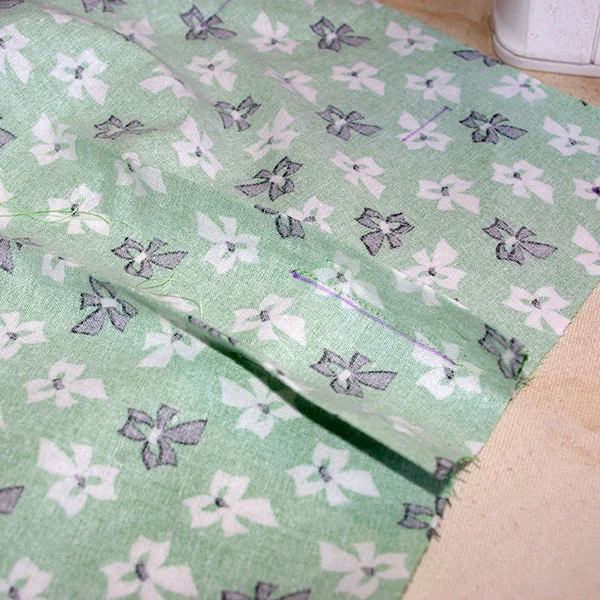 The reverse side of the bodice tucks.