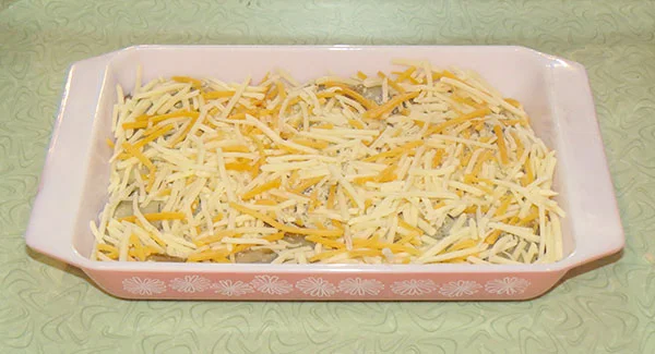 Grated cheese, which makes the dish delicious, but not particularly healthy