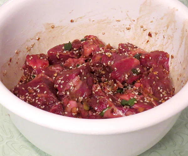 Steak tips marinating