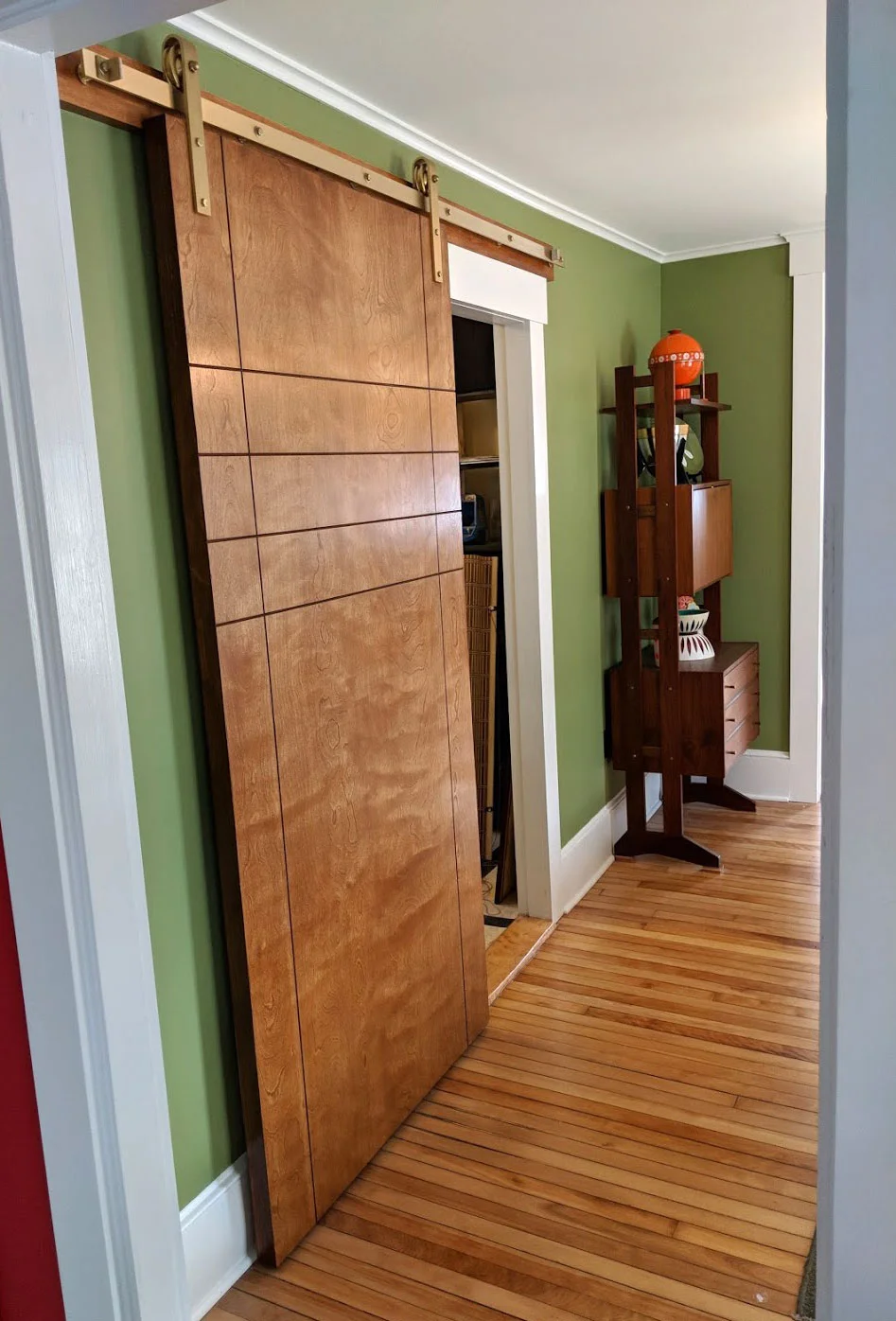 The sliding door opened.