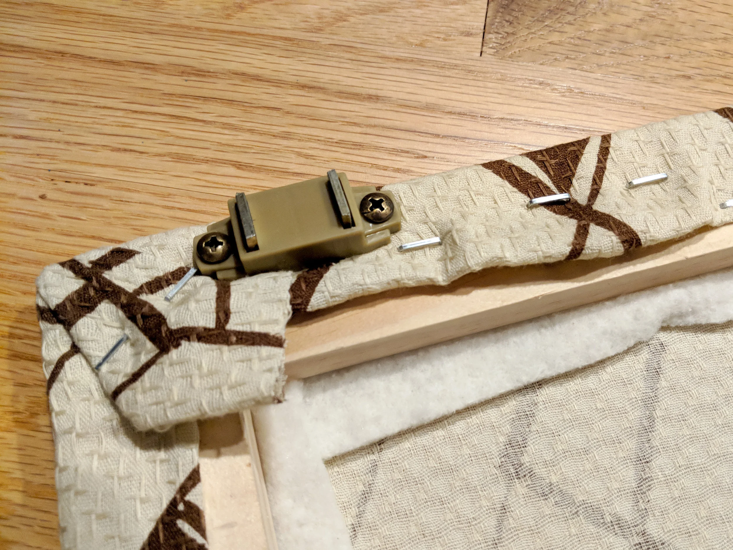 One of the magnetic cabinet latches
