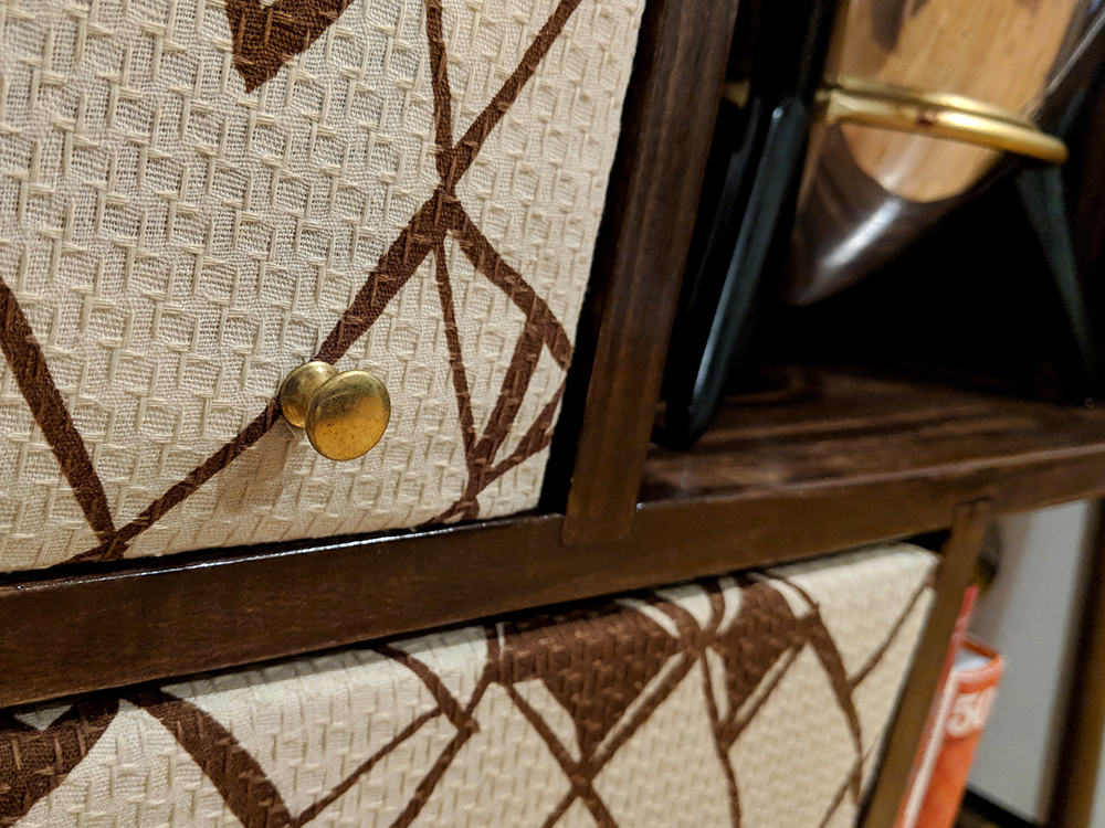 One of the brass knobs on the panel