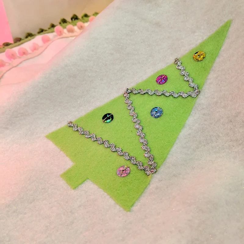 A close-up of one of the trees with rick-rack trim and sequins