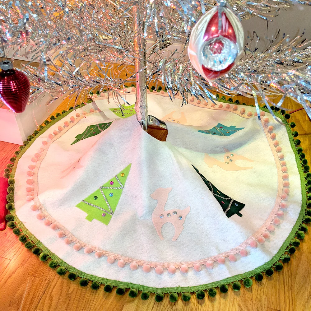 The tree skirt at the base of our aluminum tree