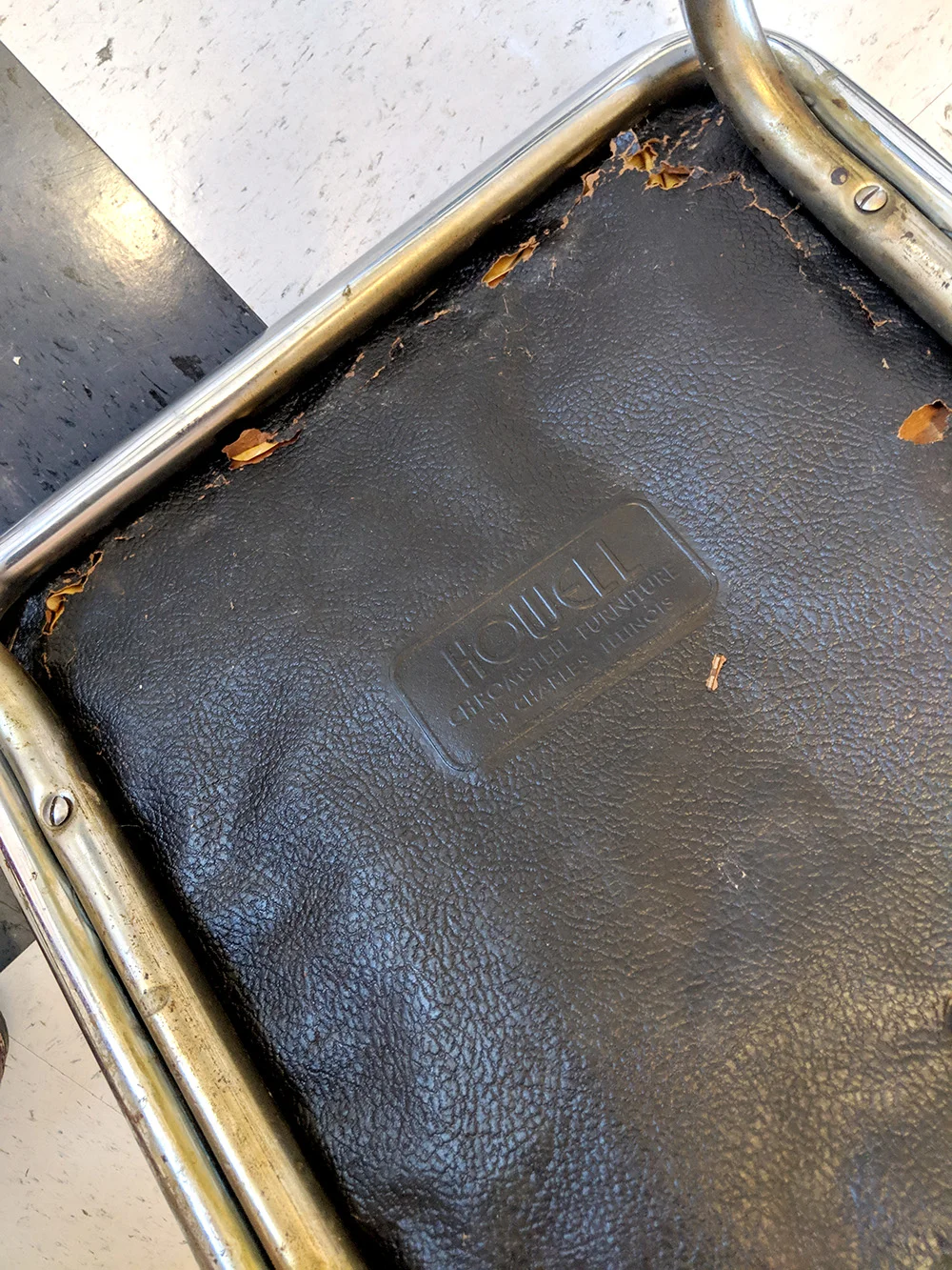 The bottom of the chair with the original “Howell” label.