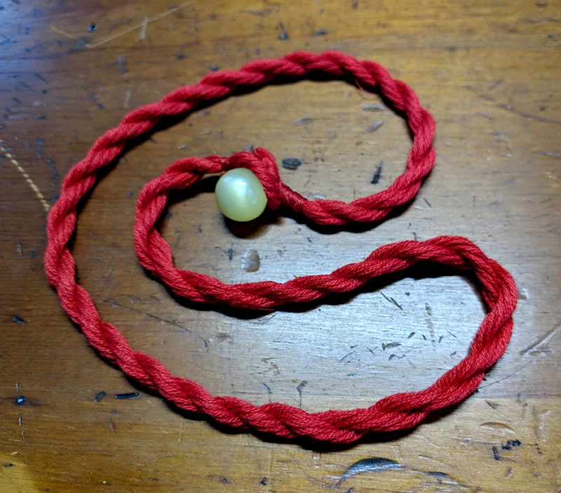 The finished cord with ball button clasp