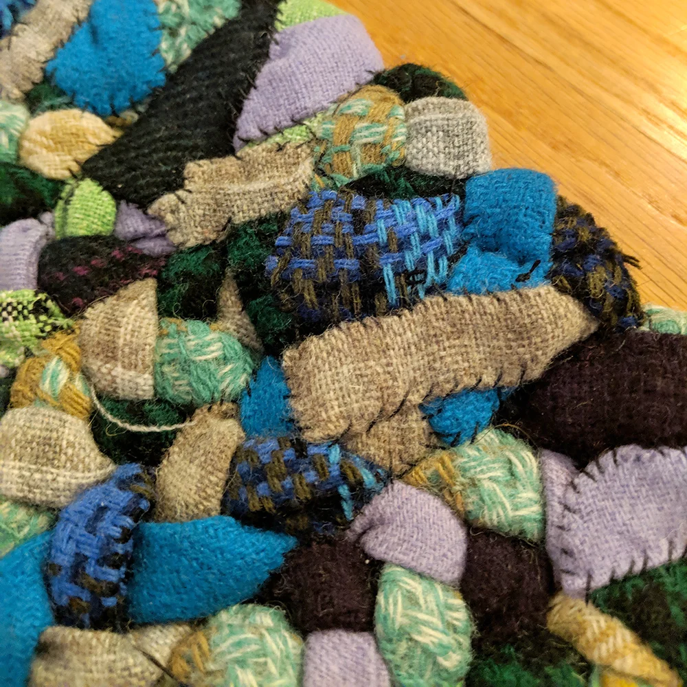 The ends of the rug folded down and stitched in place