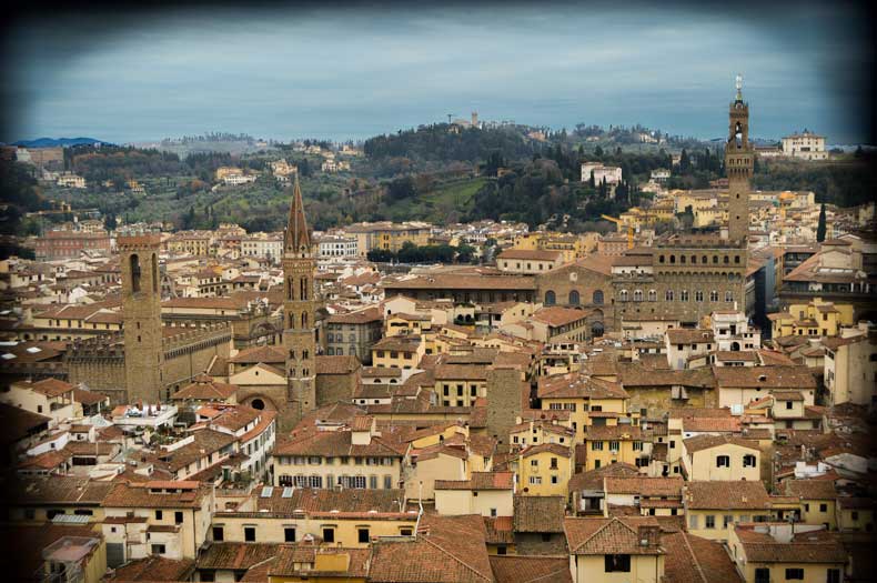 You've got the Bargello National Museum with the Volognana Tower (far left tower) built in 1256, then Badia Fiorentina which is an abbey founded in 978 with its tall spire (which was built up again in 1330 after it was destroyed as punishment by the Signoria because the monks didn't pay some taxes), and Palazzo Vecchio off to the right. Palazzo Vecchio was begun in 1299 on top of Ghibelline houses, and incorporated a tower that did not get razed. The old Roman amphitheater is buried somewhere under the palazzo too.