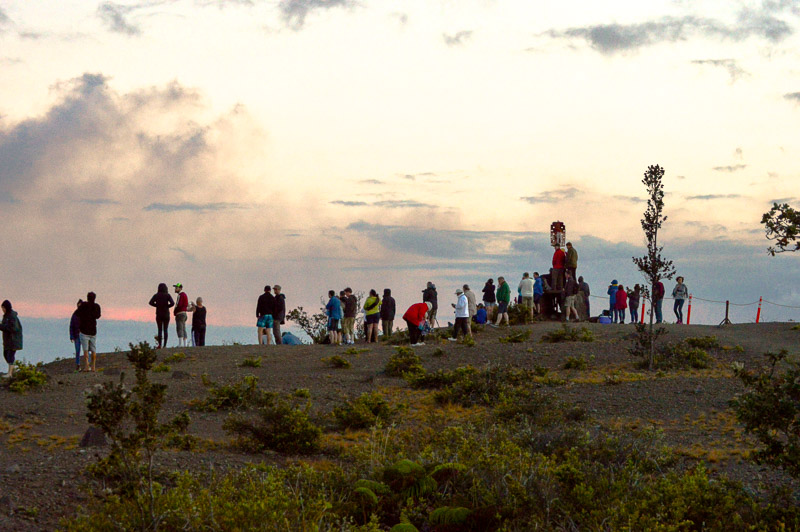 The crowd gathers impatiently. On the overlook it was standing room only as spectators pressed together.