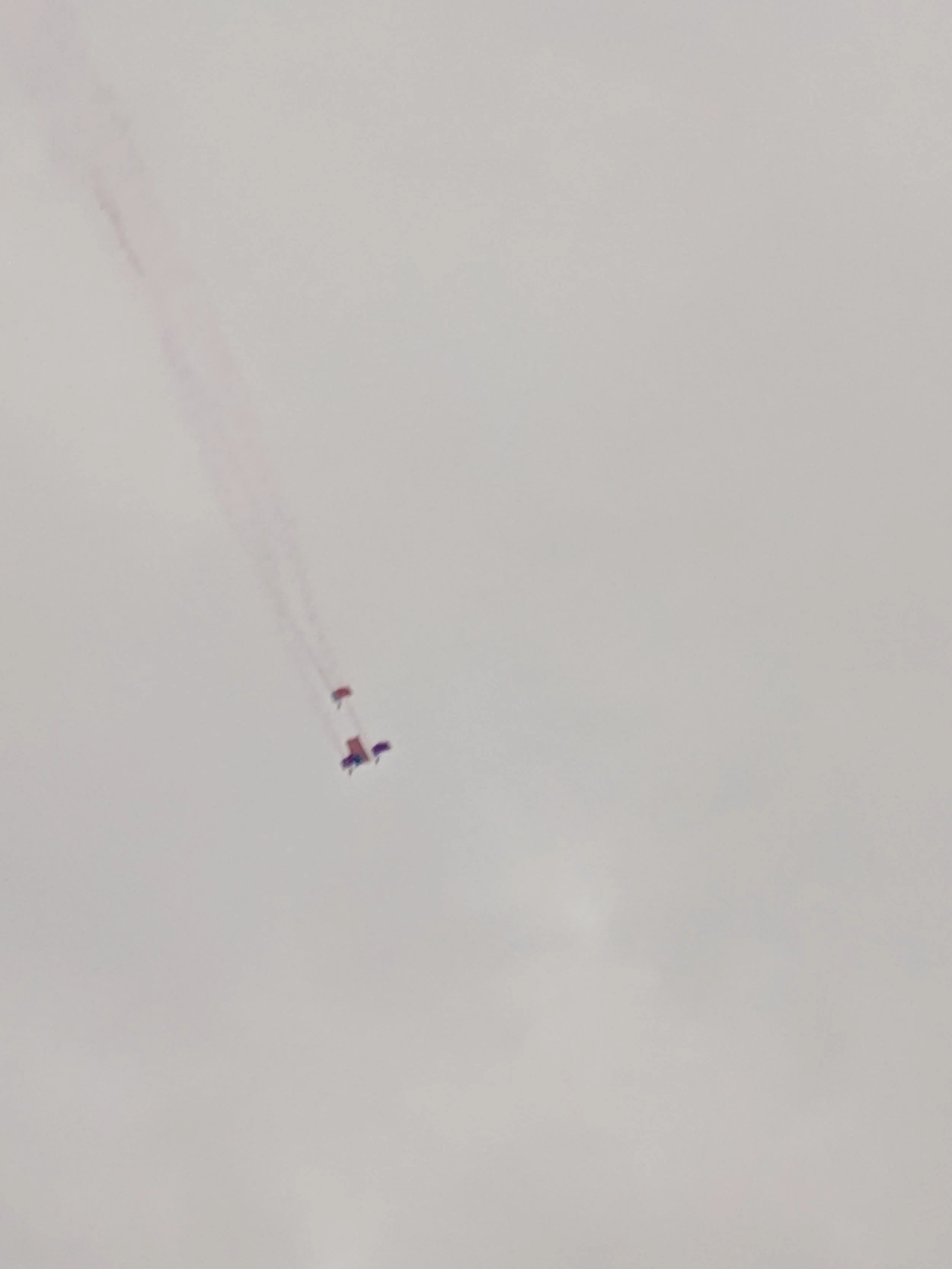 Super blurry image, but at the start line there’s a synchronized parachute jump where the parachuters carry the flag through the air. It was pretty cool.