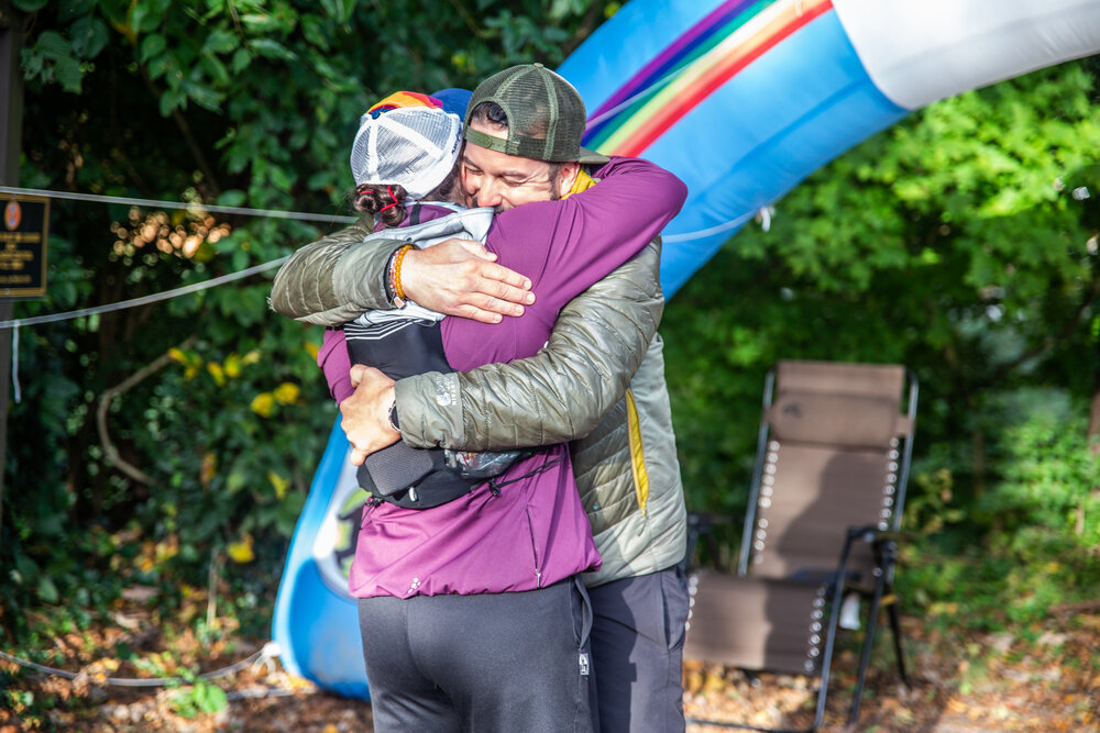  Every Yeti 100 finisher gets a hug from Jason Green, the race director. (Photo credit: Appalachian Exposures, race photographer) 