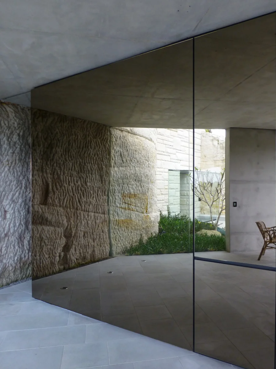 The polished bronze reflective panels used in the entertainment space gave a beautiful warmth and interesting dimension to the house. 