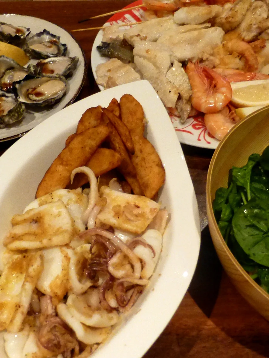 Calamari and oysters in the kitchen ready to be brought out to the verandah