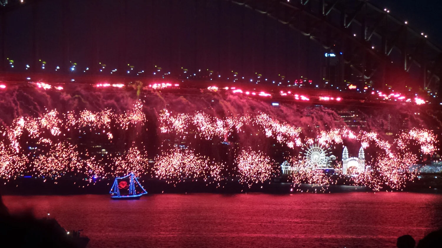 A spectacular crack and sparkle of red and the little sailing boat passing by.