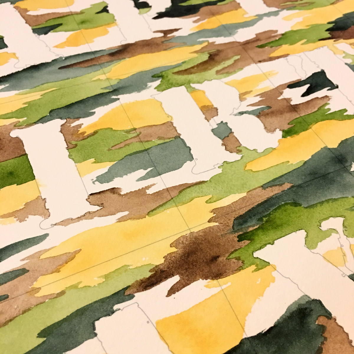 This work in progress shot demonstrates the process of layering up the watercolour texture before painting the lettering to finish. 