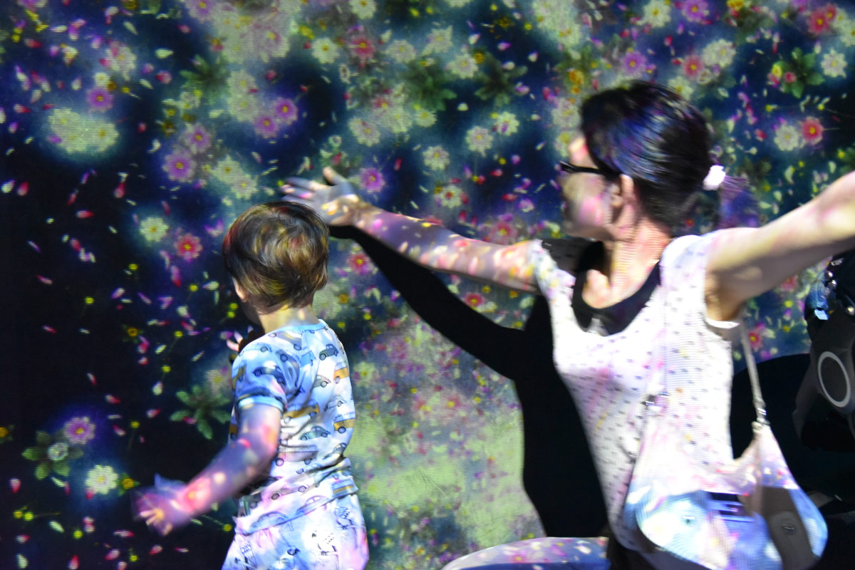 Exploring the floral projections at the Future Land exhibition. Aiden was fascinated by the colours sticking to his skin. 