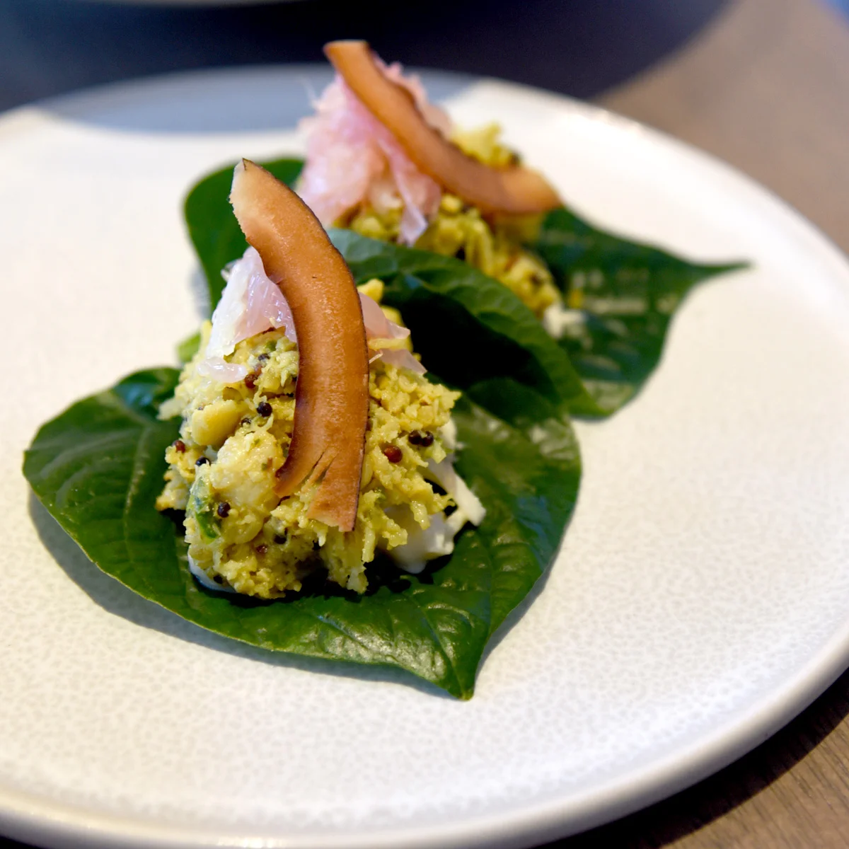 Coconut spiced spanner crab on betel leaf