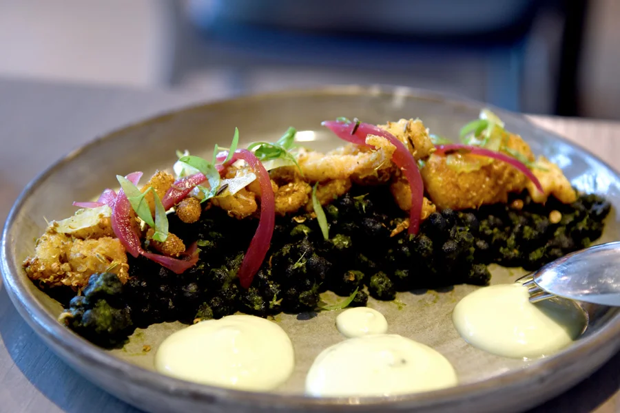 Spiced calamari and squid ink pearls