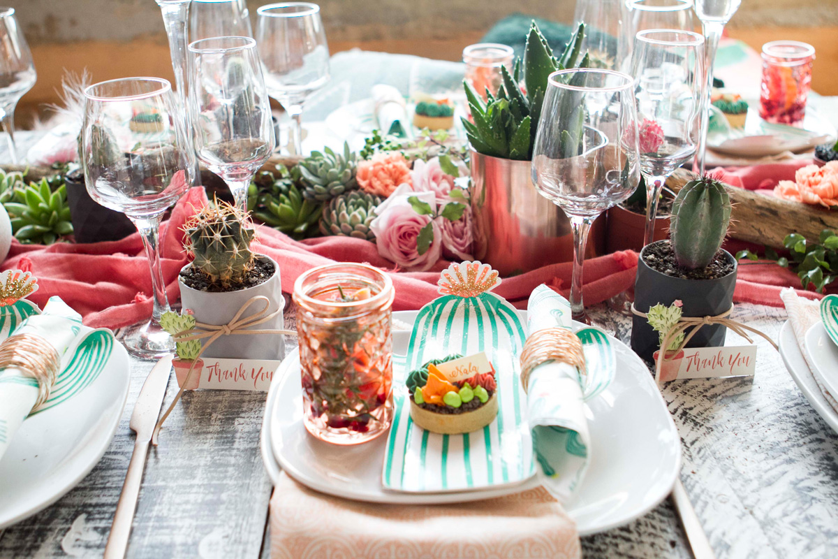 Succulents paired with wild roses are a beautiful textural centrepiece for the table. The cactus shaped party plates by Meri Meri from Favour Lane Boutique are a perfect choice for this theme.
