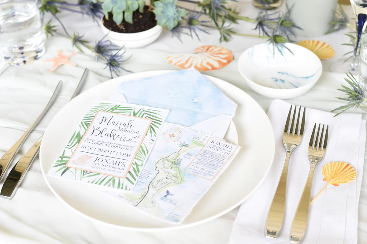 A coastal palm beach wedding invitation suite by ELK Prints in watercolours on Indie handmade paper.
