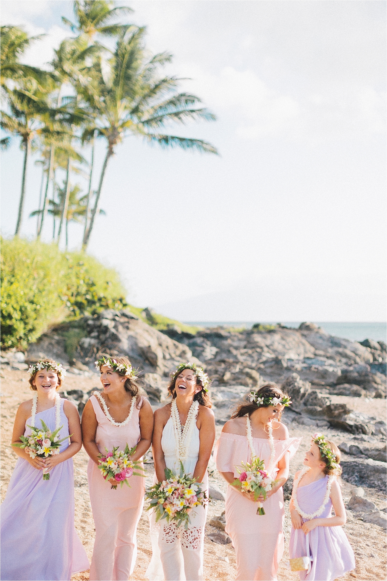 bridesmaids at hawaii beach wedding pretty pastel dresses