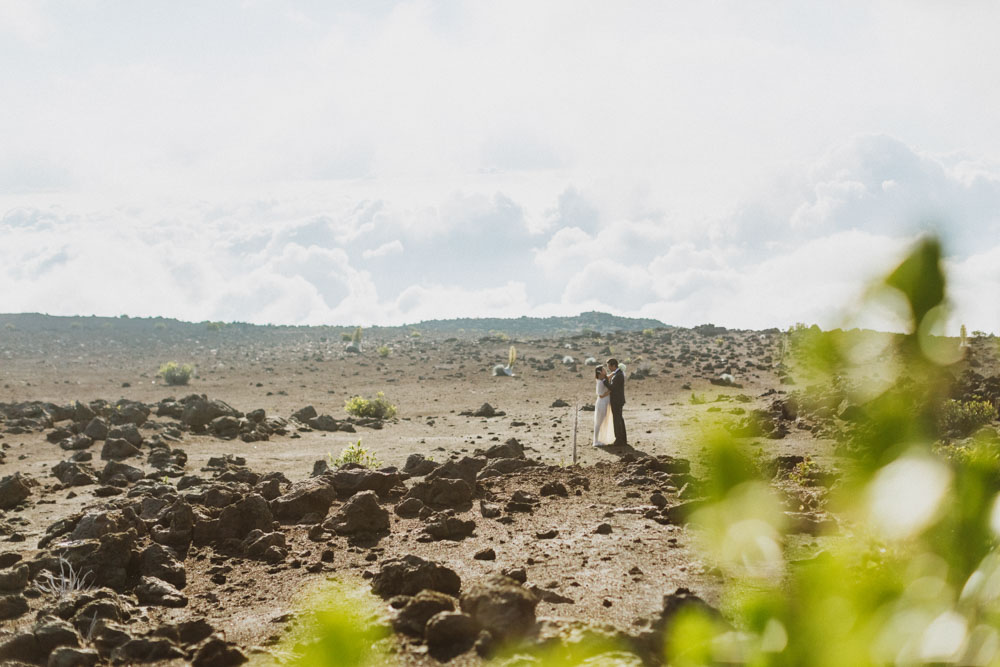 Haleakala Bride and groom walking on lava rock maui