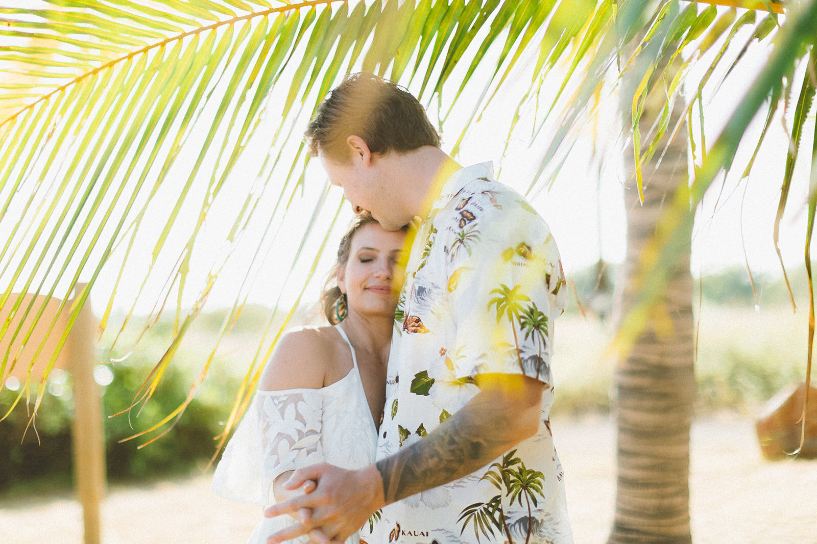  Top Maui Wedding photographer Angie Diaz Captures beautiful tropical engagement session with the perfect sun flare and romance your heart needed. Location: Palm Trees at Olowalu, Lahaina , Hawaii 