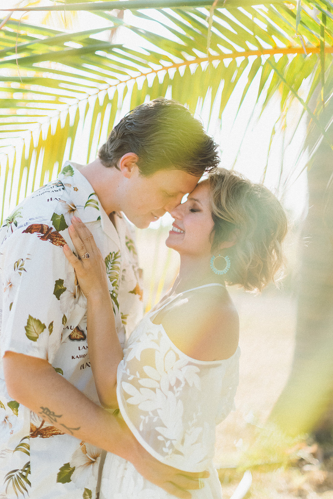  Top Maui Wedding photographer Angie Diaz Captures beautiful tropical engagement session with the perfect sun flare and romance your heart needed. Location: Palm Trees at Olowalu, Lahaina , Hawaii 