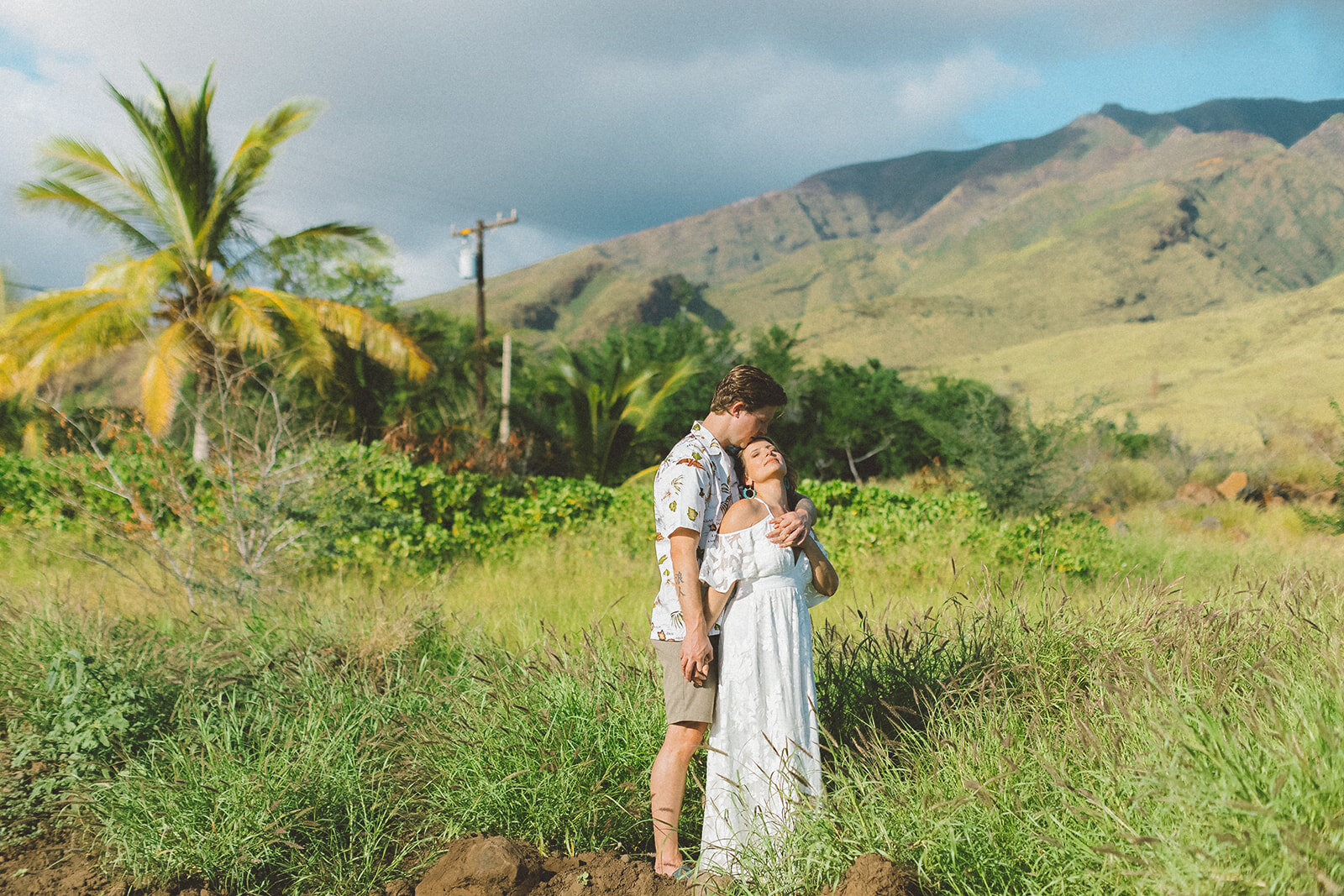  Top Maui Wedding photographer Angie Diaz Captures beautiful tropical engagement session with the perfect sun flare and romance your heart needed. Location: Palm Trees at Olowalu, Lahaina , Hawaii 