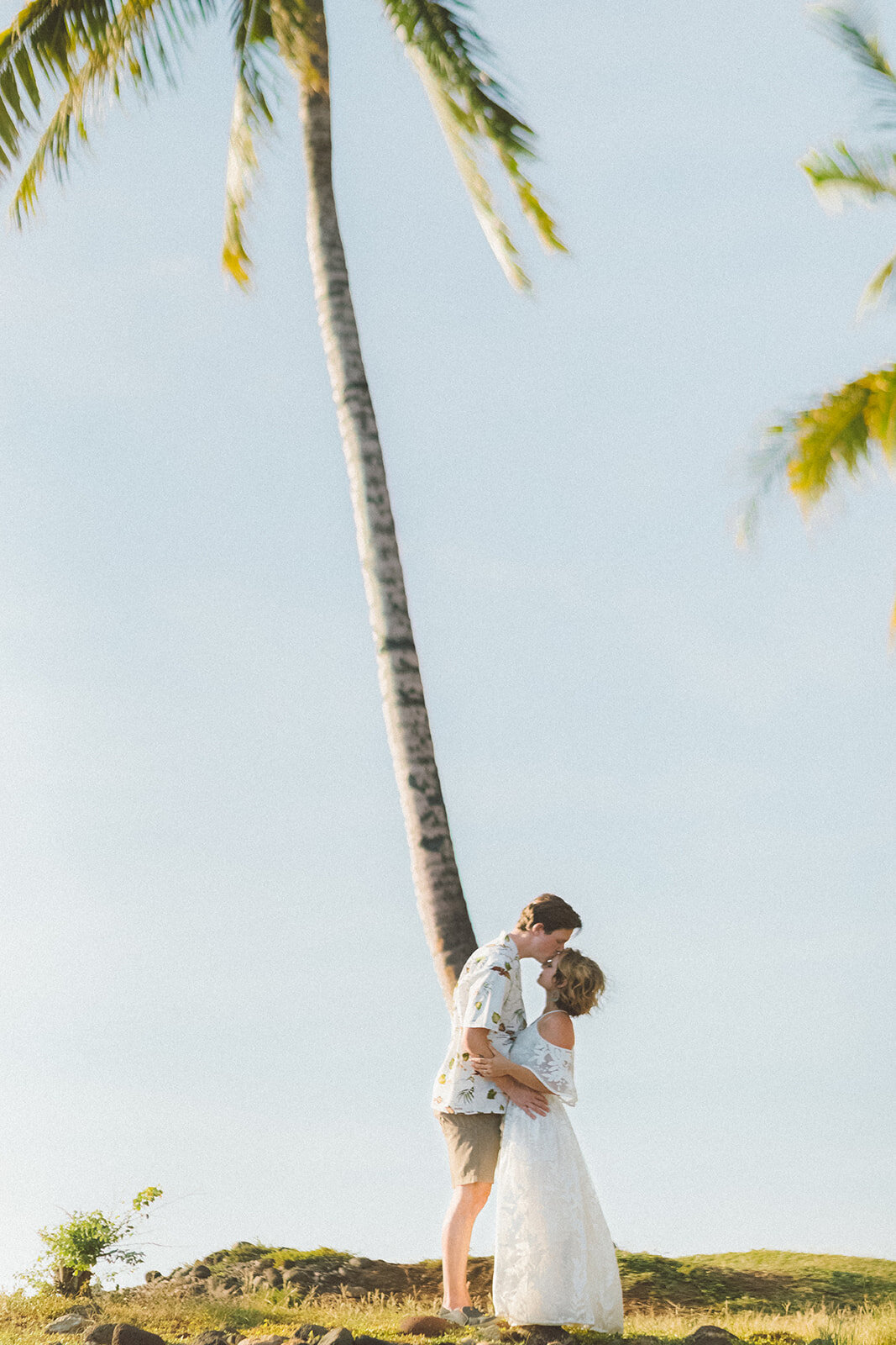  Top Maui Wedding photographer Angie Diaz Captures beautiful tropical engagement session with the perfect sun flare and romance your heart needed. Location: Palm Trees at Olowalu, Lahaina , Hawaii 