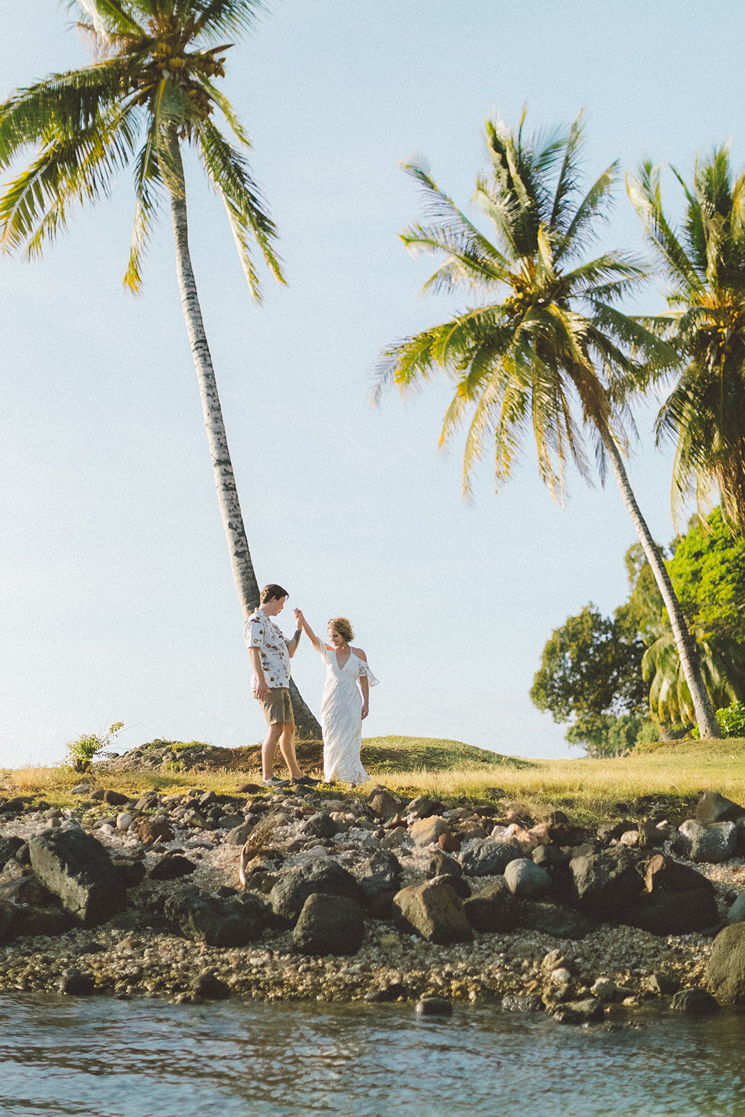  Top Maui Wedding photographer Angie Diaz Captures beautiful tropical engagement session with the perfect sun flare and romance your heart needed. Location: Palm Trees at Olowalu, Lahaina , Hawaii 