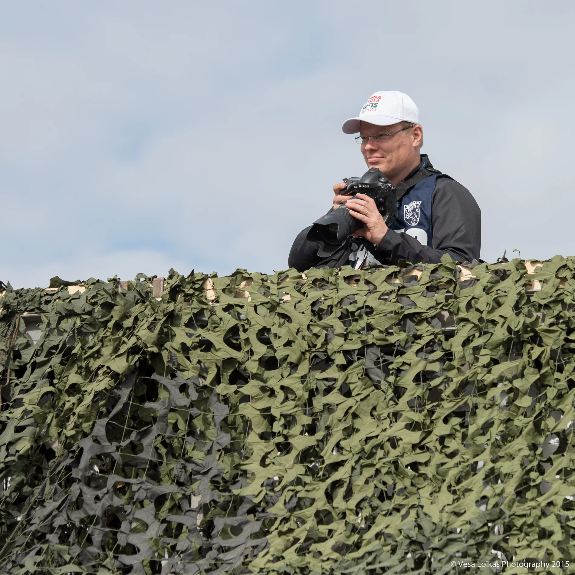 A colleague Ilkka Seppä checking out the angles on the bridge by the start area.