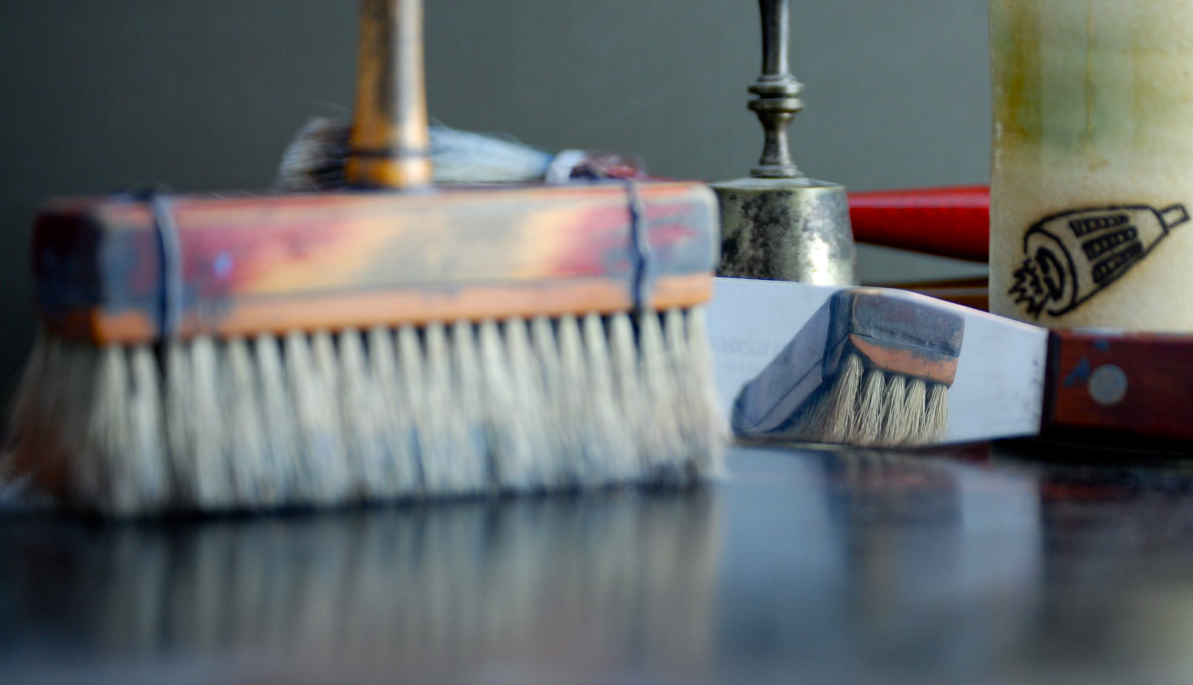 Studio workspace showing paint brushes and palette knife.