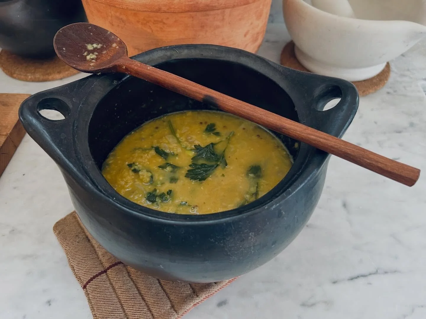 Still craving soups and stews in all of this fluctuating weather! Split lentils with yellow onion, fresh ginger, coriander seeds, paprika, crushed red pepper, tumeric, cardamom, and oregano. Lentils are soaked for 12-24 hrs and rinsed well. Sautee on