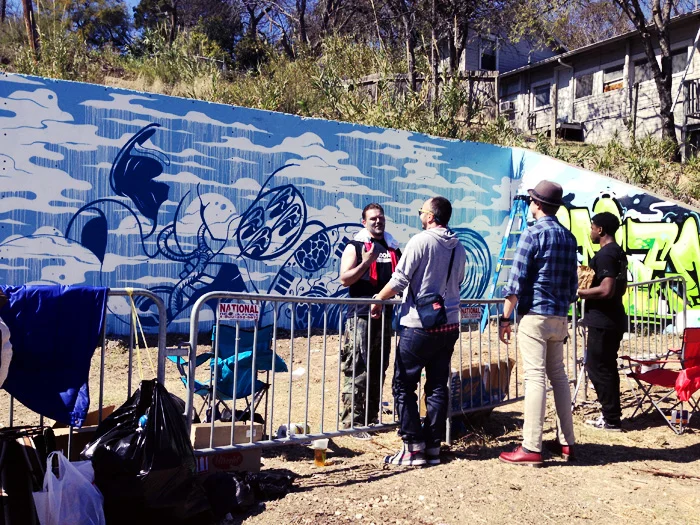 Just so happened to be randomly driving around with Justin and Sebastian when we spotted their old friend Tristan Eaton in graffiti park working on his several day mural job. Here are the dudes catching up with Tristan on a little break.