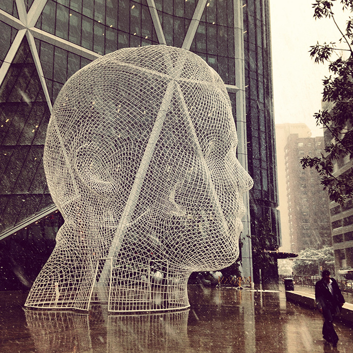 Jaume Plensa's sculpture outside the Bow and the beginnings of the September snow.