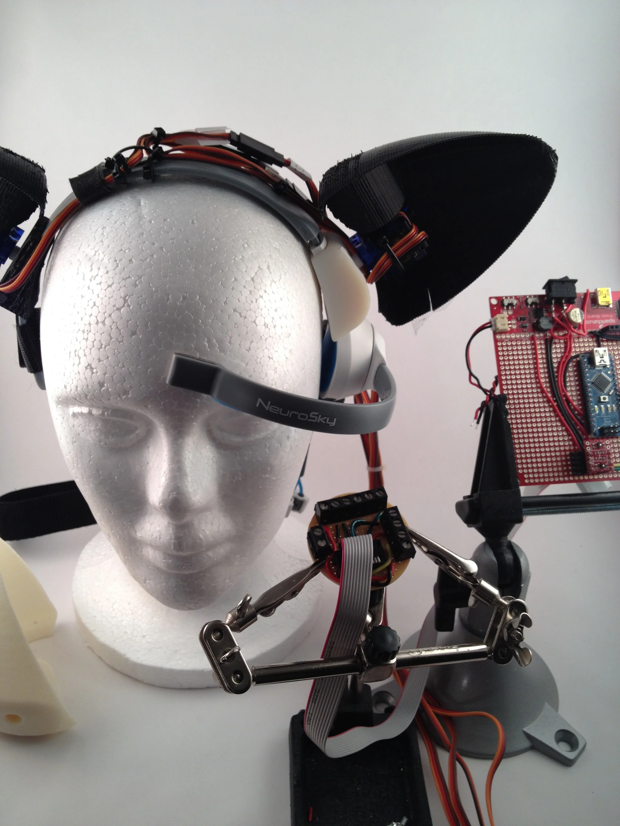  The final prototype used an Arduino Nano and a Sparkfun prototype board, with lithium polymer rechargeable batteries to power the Arduino and the servos. The Sparkfun board had built-in power regulators, which provided both 5 and 3.3 volts, and a co