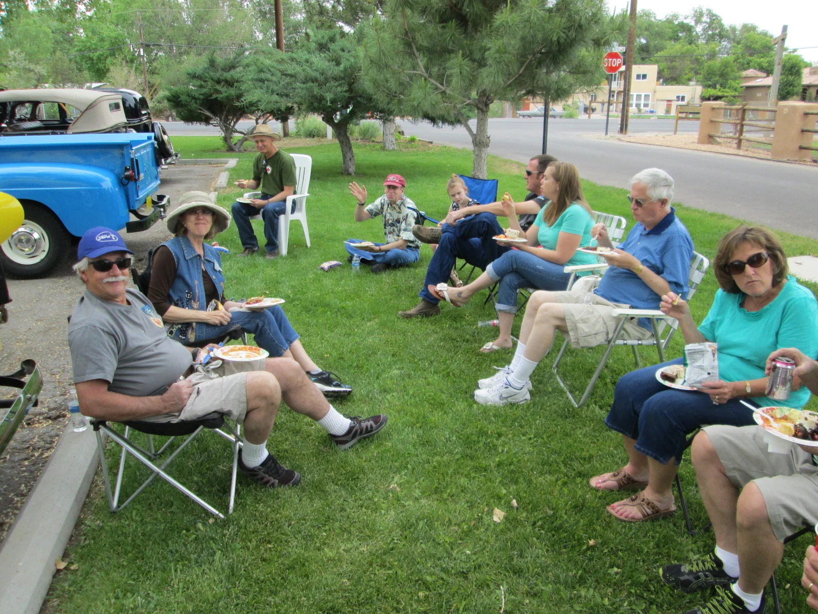 Club President Jay forgot his chair --- grass seating is great.