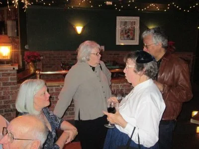 Micki explains to Ray the ongoing activities while Neva and Joyce have a chat.&nbsp; Marvin in the foreground.