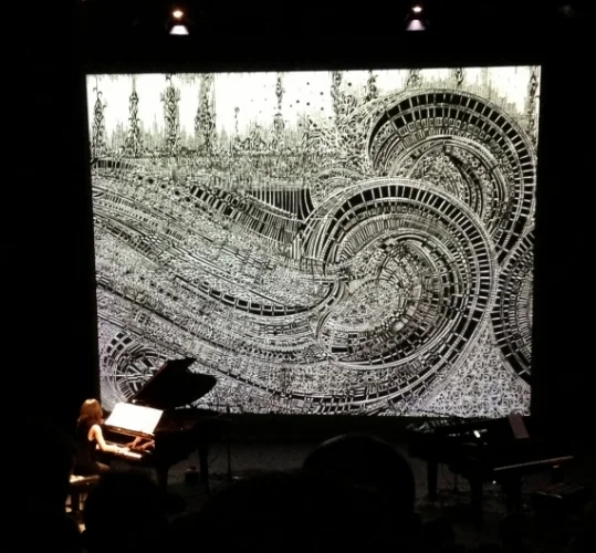 Izumi Kimura performing Impressions De La Mer - Movement 1 at The Samuel Beckett Theatre with Movement 2 projected in the background. 